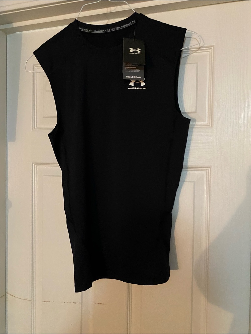 Under Armour Black Women’s HeatGear Sleeveless Muscle Tee. Compression